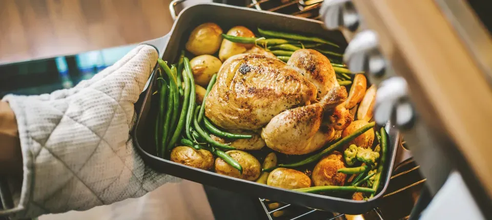 photo of a cooked turkey surrounded by green beans